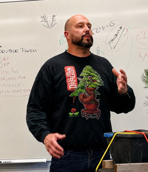 Mauro Stemberger teaching in front of a whiteboard during his seminar.