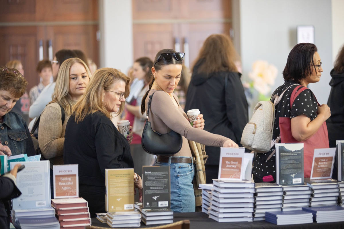 Women browsing books at MORE